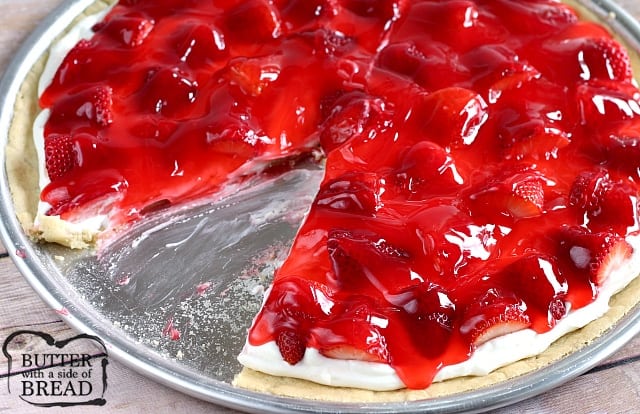 This delicious Glazed Strawberry Fruit Pizza is made with pre-made sugar cookie dough topped with a cream cheese layer, fresh strawberries and a strawberry glaze!