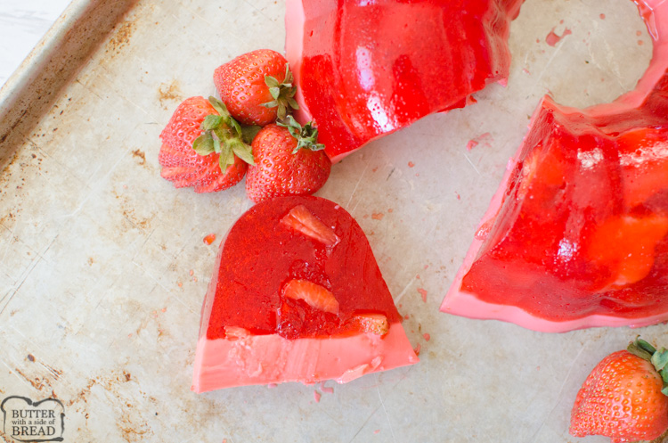 Strawberry Jello Mold is a fun way and delicious way to serve jello salad. The jello is set in a bundt pan & has two layers, fresh strawberries in jello and a creamy sweet jello bottom layer! Perfect way to serve a fancy jello treat!