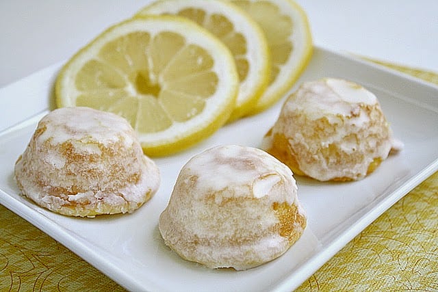 Little Lemon Drop Glazed Mini Cupcakes are delicious bite-sized treats that start with a lemon cake mix! The easy lemon glaze soaks into the inverted mini cupcakes and is a simple, incredibly delicious lemon cake mix recipe!