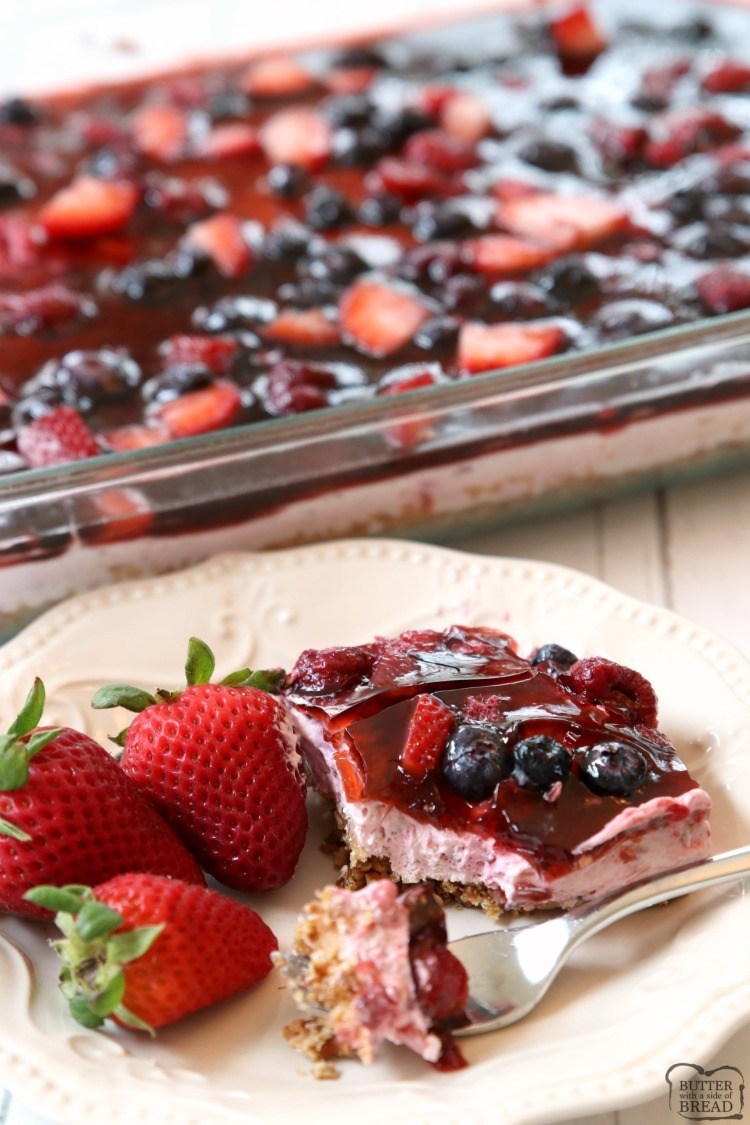Berry Jello Pretzel Salad made with fresh berries & fruity Jell-O on a buttery pretzel crust! Gorgeous Jello salad recipe that tastes amazing and is so easy to make.