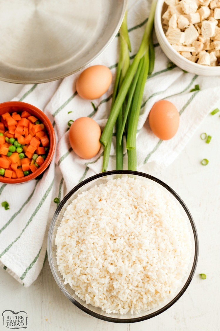 Ingredients for fried rice recipe. Chicken fried rice ingredients. Rice, chicken, egg, veggies. 