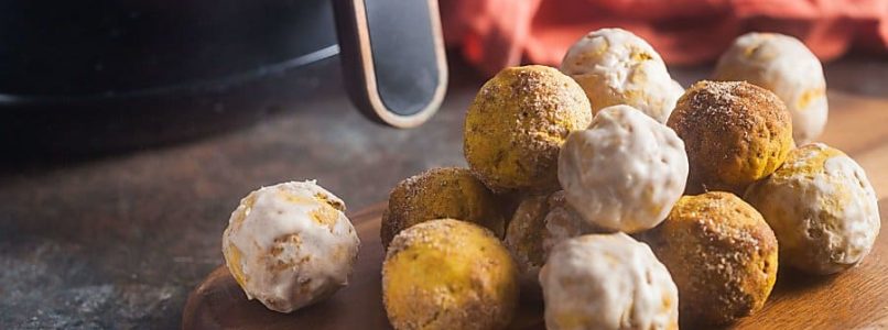 air fried pumpkin spice donut holes on a wooden board