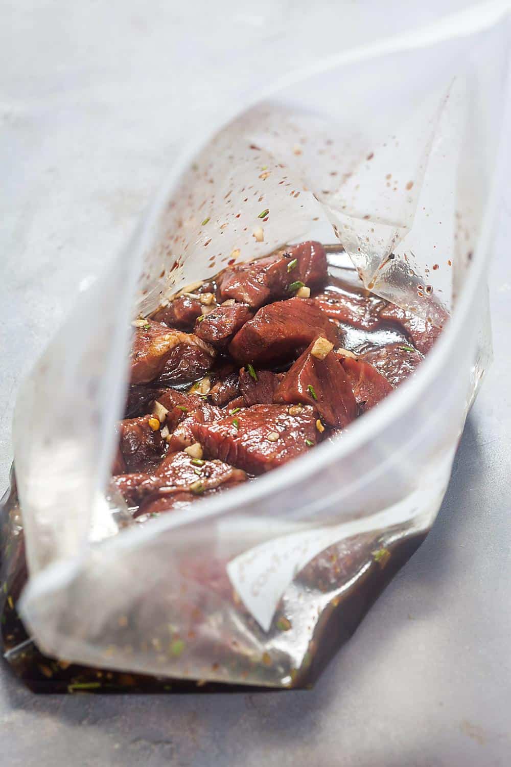 steak tips in a bag with marinade