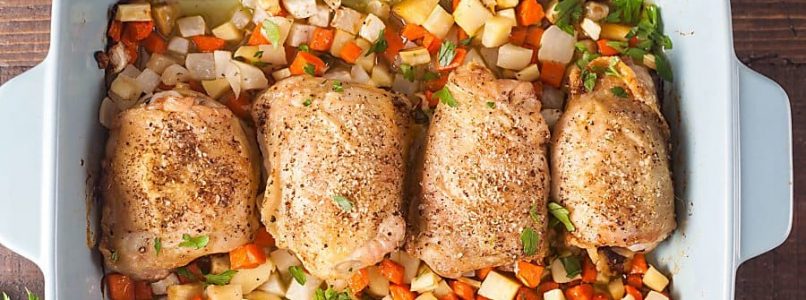 crispy baked chicken thighs with root vegetables on a plate