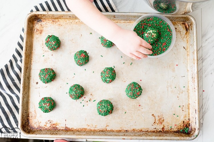 rolling the sugar cookie dough in sprinkles
