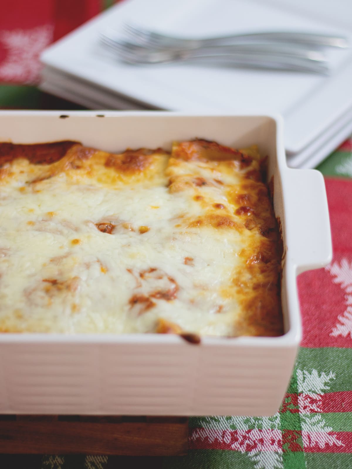 A delicious homemade lasagna with creamy béchamel and ricotta cheese inside. Traditional Lasagna is a comfort food classic.