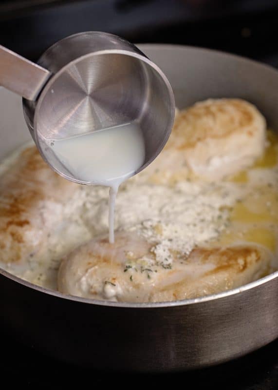 Adding milk to sauce for Creamy Chicken Skillet