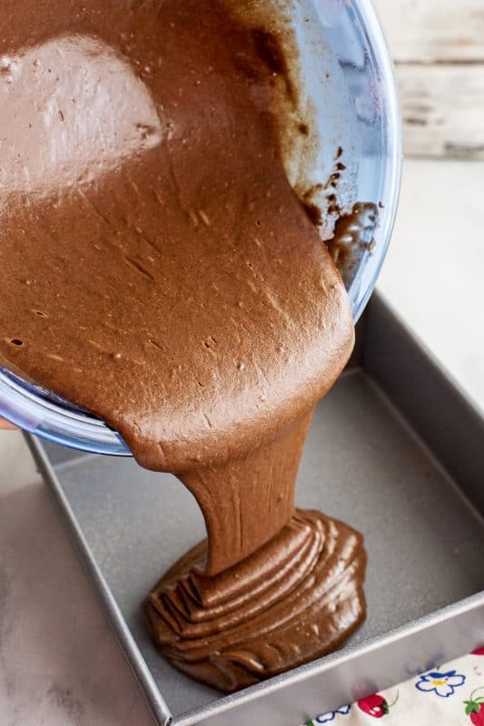 Pouring chocolate batter into cake pan