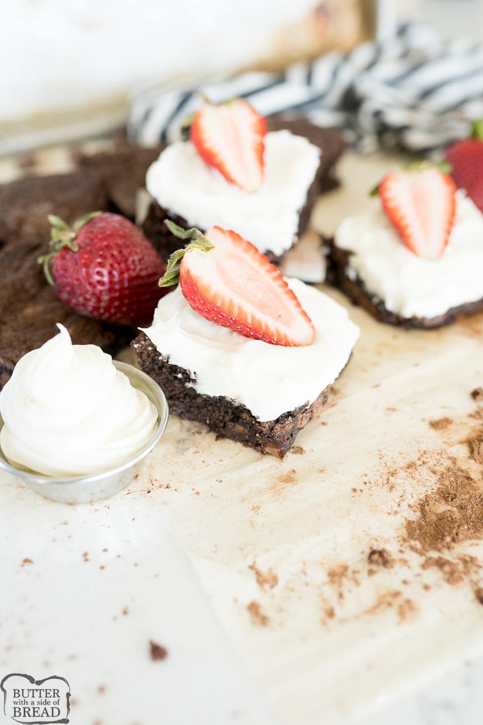 brownie with cheesecake frosting and strawberries