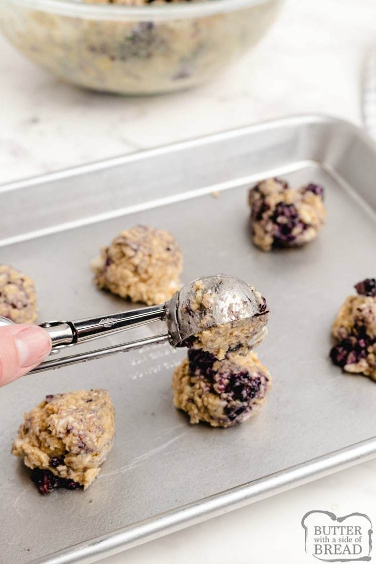 Scooping blackberry oatmeal cookies
