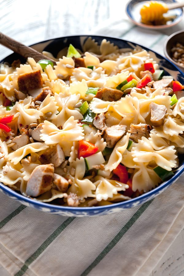 A big bowl of pasta salad with chicken