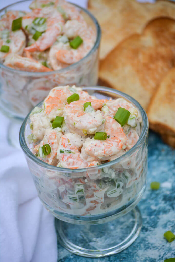 Creamy shrimp salad in a glass serving dish