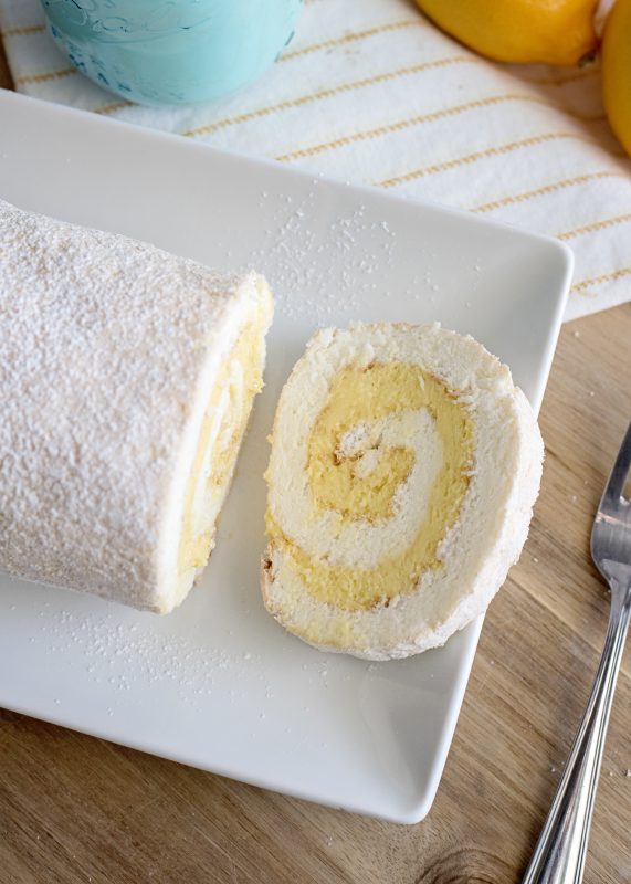 slice more of the lemon angel food cake roll for guests