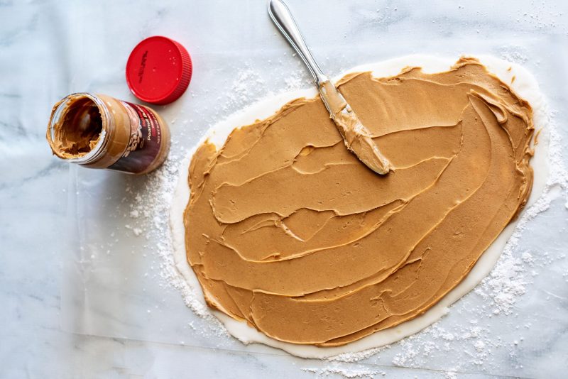 spread peanut butter on potato dough