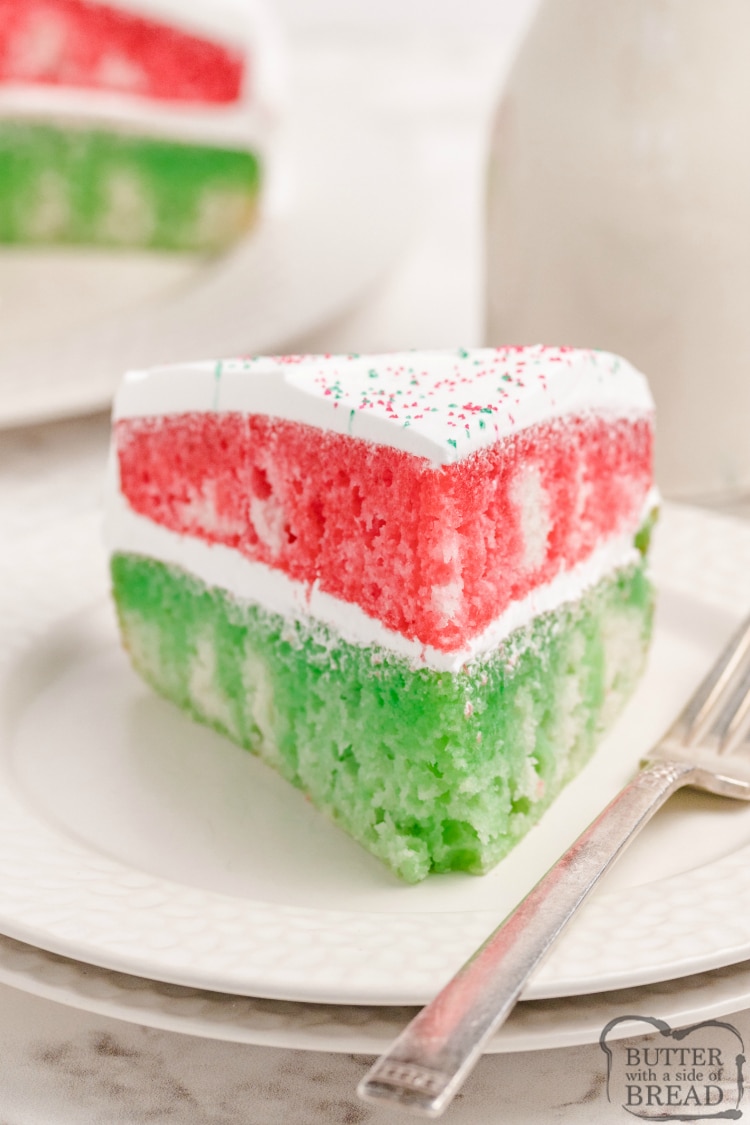 Christmas Jello Poke Cake uses a cake mix and red and green Jello to make a simple and delicious holiday dessert! This Christmas cake recipe is easy to make and absolutely beautiful to serve! 