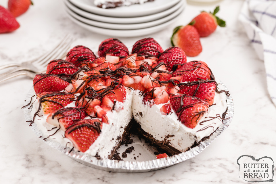 Strawberries and Cream Pie is a delicious no-bake pie recipe that is light and refreshing and so easy to make! Sweet cream cheese filling in an Oreo crust, topped with tons of fresh strawberries!