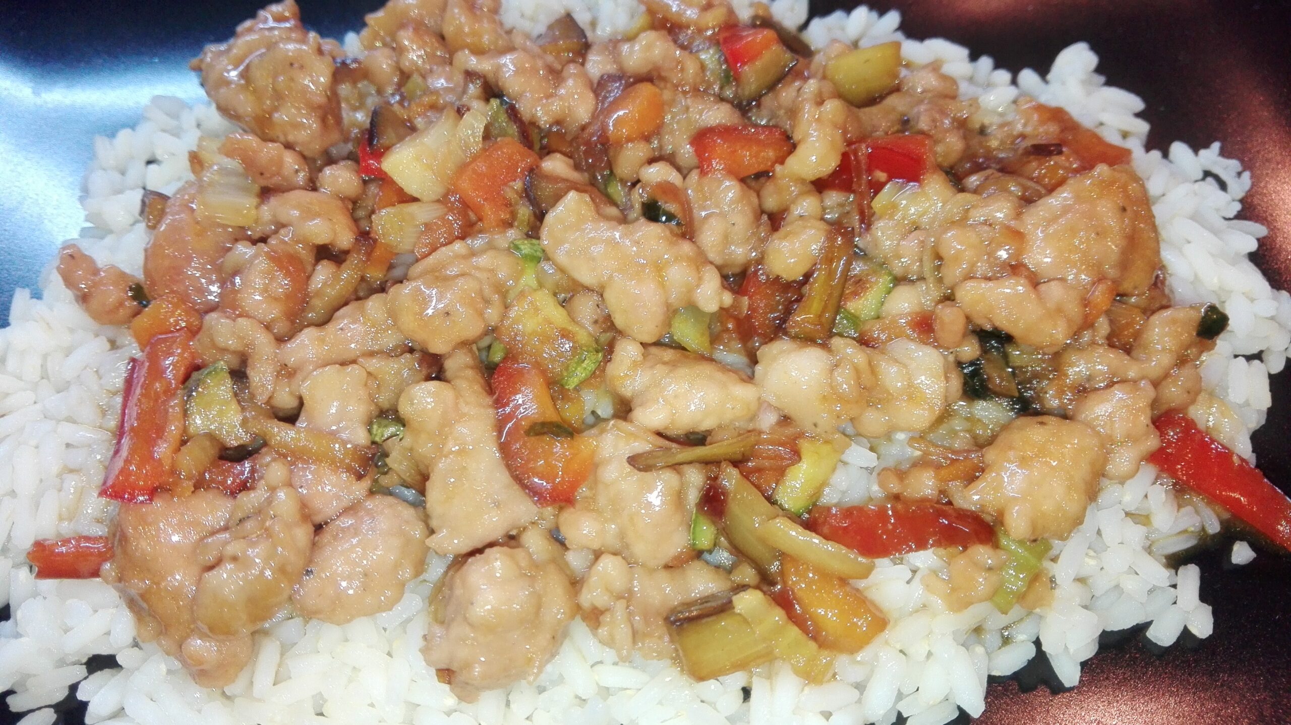 pork with sweet and sour vegetables on pilaff rice