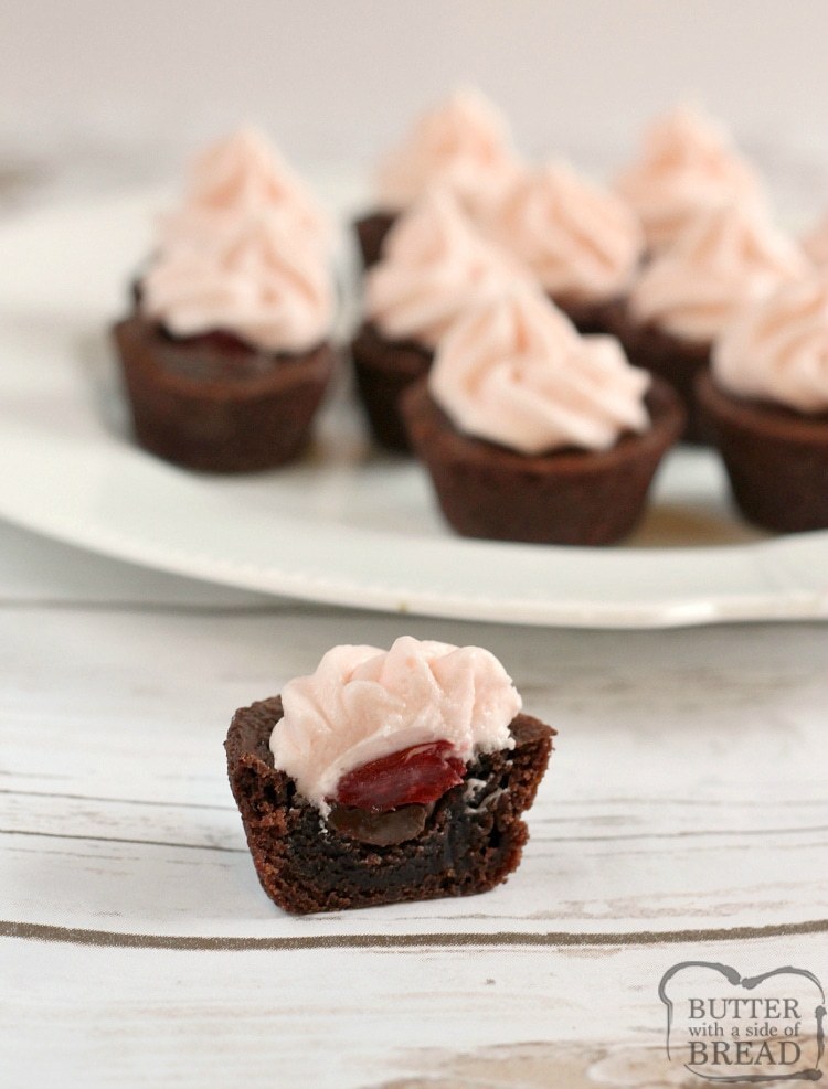Chocolate Cherry Brownie Bites are mini brownies filled with chocolate chips, maraschino cherries and then topped with a cherry flavored cream cheese frosting! Simple brownie recipe that starts with a box of brownie mix.