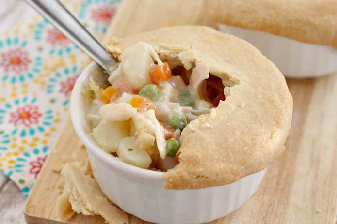Chicken Pot Pie is the ultimate comfort food full of chicken and vegetables in a creamy sauce covered with a flaky pie crust. This Chicken Pot Pie recipe is a family favorite because it is easy to make and is absolutely delicious too!