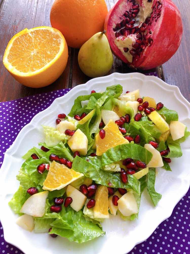 Autumn salad with fruit and pomegranate